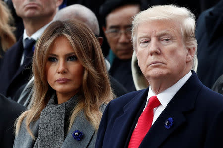 U.S. President Donald Trump and first lady Melania Trump attend a commemoration ceremony for Armistice Day, 100 years after the end of the First World War at the Arc de Triomphe in Paris, France, November 11, 2018. REUTERS/Benoit Tessier/Pool/File Photo