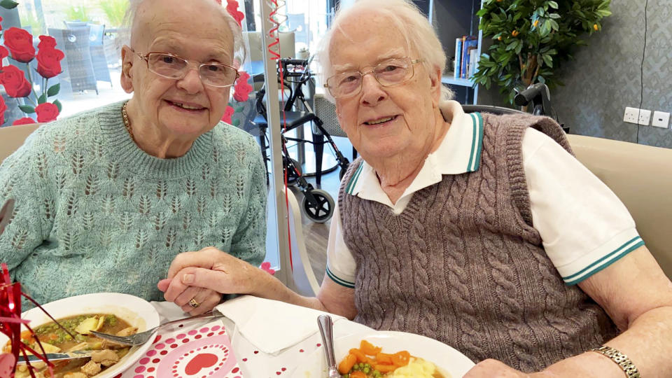 This is the moving moment a devoted wife surprised her dementia-stricken husband by moving into his care home after a month apart - because she 'can't live without him'. Pensioner Kenneth Meredith, 96, walked through the door with his zimmer-frame and broke down in tears when he saw wife Betty Meredith, 91, sitting down in front of him. Seconds later he rushes over to his wife of 71-years, who is seen sitting at a table for a make-shift date night, decorated with heart shaped balloons and roses. With The Platters' 1954 hit 'Only You', playing in the background, the couple share a long hug, after spending five weeks apart. The pair were heartbroken after Kenneth moved into Bourn View Care Home, Birmingham, five weeks ago due to his worsening battle with Alzheimer's. Due to strict rules, he couldn't see wife Betty, who he has been with for 76 years. And with no sign the pandemic was lifting, lonely Betty asked if she could be moved into the care home because she could no longer be apart from her husband. Unbeknown to Kenneth, Betty had moved into the floor below as she waited for her Covid-19 test results - but would continue to phone him for their daily chats. Once her results came back negative, Betty and staff helped arrange the surprise for Kenneth on November 10.