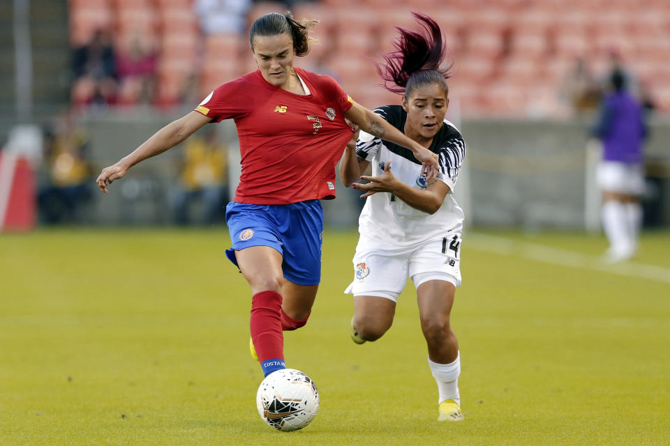 Panama defender Maryorie Perez (14) pulls on the jersey of Costa Rica forward Melissa Herrera (7) during the first half of a women's Olympic qualifying soccer match Tuesday, Jan. 28, 2020, in Houston. (AP Photo/Michael Wyke)