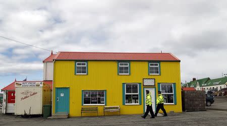 Falkland Islands policemen patrol the streets in Stanley, March 11, 2013. REUTERS/Marcos Brindicci/File Photo