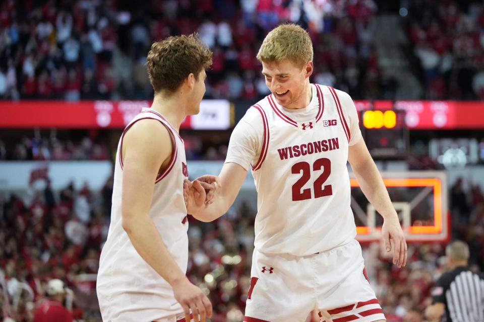 Feb 20, 2024; Madison, Wisconsin, USA; Wisconsin Badgers forward Steven Crowl (22) celebrates the Wisconsin Badgers 74-70 victory with Wisconsin Badgers guard Max Klesmit (11) against the Maryland Terrapins during the second half at the Kohl Center. Mandatory Credit: Kayla Wolf-USA TODAY Sports