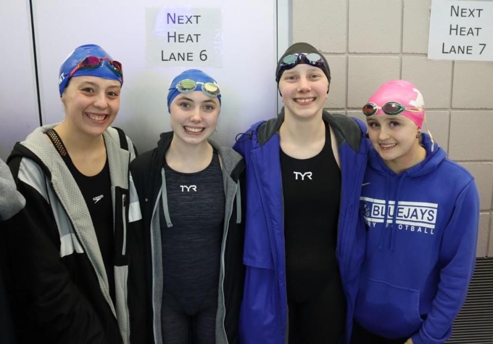 Natalie Kent, Elizabeth Drake, Emily Dowd and Sophia McDevitt pose for a photo after their 15-18 Girls 200 Yard Freestyle Relay team placed first during the GISL State Meet on Saturday, March 9, 2024, in Des Moines.