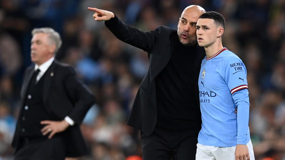 Guardiola gives instructions to Foden during the Champions League semifinal second leg match between City and Real Madrid on May 17, 2023. - Michael Regan/Getty Images