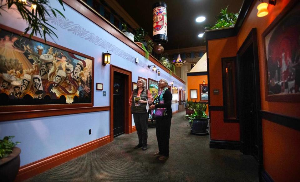 Meredith Arseneau (left) of Pouslbo and Sarah Beckett of Silverdale tour the atrium at the McMenamins Elks Temple in downtown Tacoma on Wednesday, May 22, 2024.