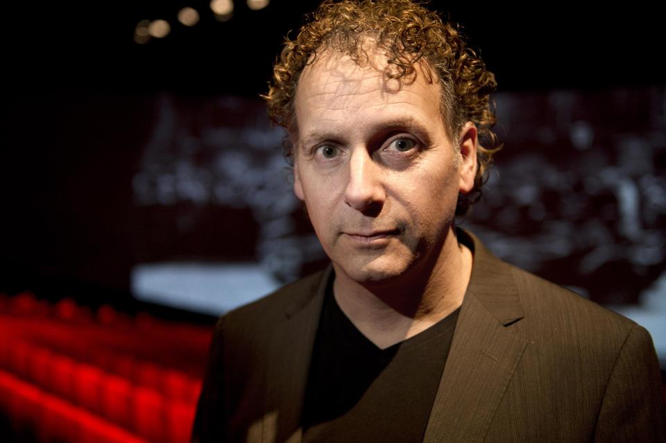 In this photo taken Friday, May 2, 2014 producer Robin de Levita poses during an interview with the Associated Press at Theater Amsterdam. Seeking to engage a new generation with the tragic story of Anne Frank, a major new play based on the Jewish teenager's diary opens Thursday, May 8, 2014 in Amsterdam. It's the first time a theatrical production has been forged directly from Frank's actual writings since the award-winning 1950s play that escalated her story, then little-known, to the world's attention. It's being staged in a purpose-built 1,100 seat theater that includes a replica of the secret apartment where Frank and her family hid from the Nazis in World War II. (AP Photo/Evert Elzinga)