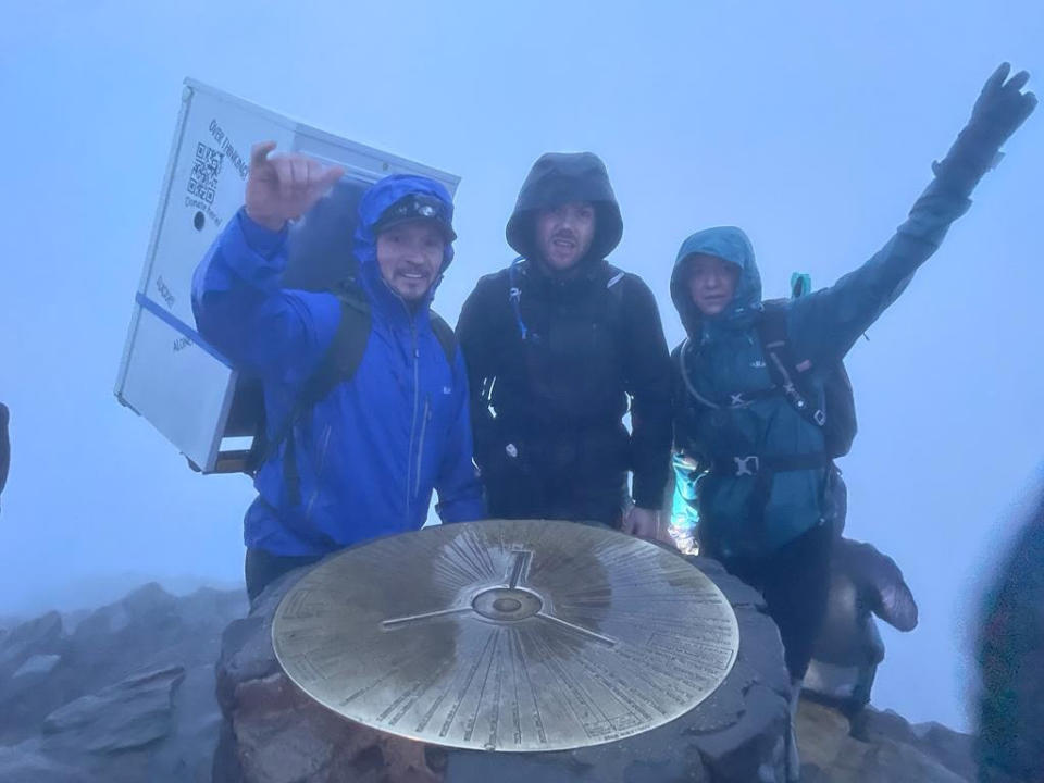 Michael Copeland and his friends at Snowdon's summit. (SWNS)