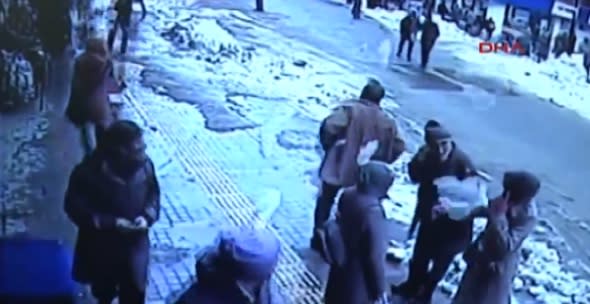 Pedestrians covered in 'snow avalanche' from shop roof