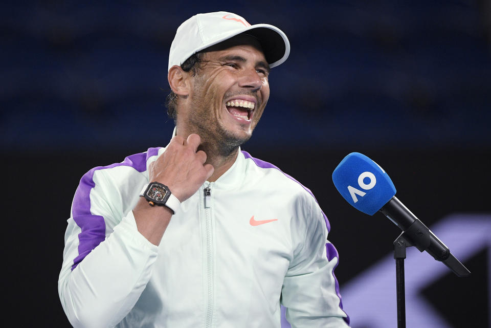 Spain's Rafael Nadal laughs during an interview following his win over Britain's Cameron Norrie in their third round match a the Australian Open tennis championships in Melbourne, Australia, Saturday, Feb. 13, 2021. (AP Photo/Andy Brownbill)