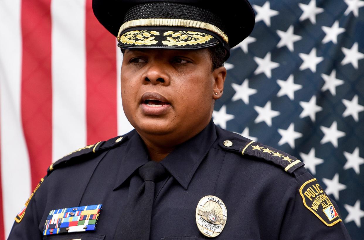 Interim Police Chief Romona Harris speaks as people gather to lay wreaths at the monument honoring fallen police officer Keith Houts and fallen community volunteer Ruben Moulton in the Newtown community in Montgomery, Ala., on Friday December 17, 2021.
