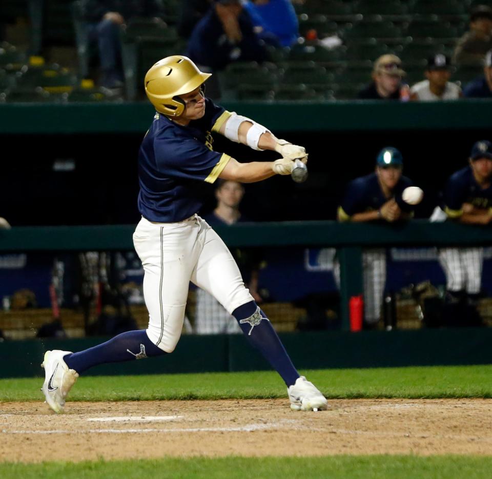 New Prairie junior Beau Kmiecik swings at a pitch during a baseball game against Adams Monday, April 15, 2024, at Four Winds Field in South Bend.