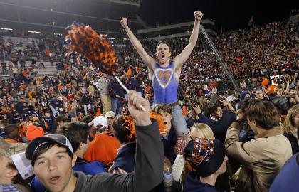 Auburn fans storm the field after the Tigers' 34-28 Iron Bowl win over Alabama. (AP)