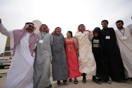 Syrian men and women dance after the First Constituent Conference of Deir Al-Zour Civil Council was announced, in the northern area of Deir al-Zor, Syria September 24, 2017. REUTERS/ Rodi Said