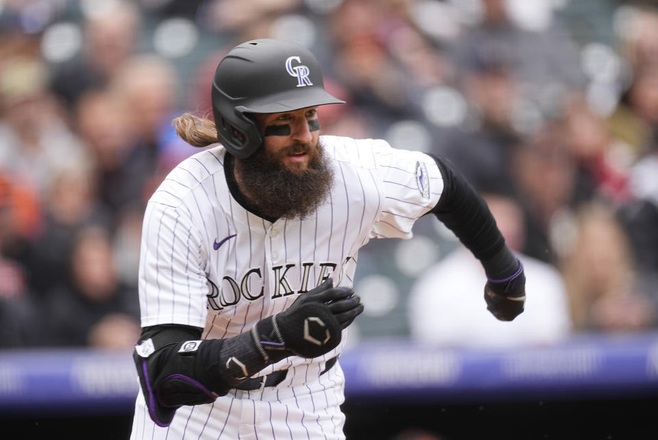 Colorado Rockies' Charlie Blackmon heads up the first-base line on a ground out against San Francisco Giants starting pitcher Keaton Winn in the third inning of a baseball game Thursday, May 9, 2024, in Denver. (AP Photo/David Zalubowski)