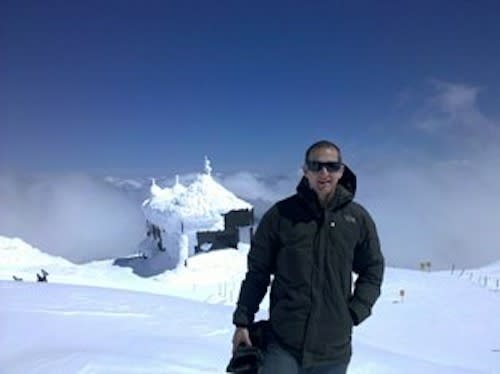 David Smith in front of the Mt. Bachelor Observatory, where atmospheric samples are collected.