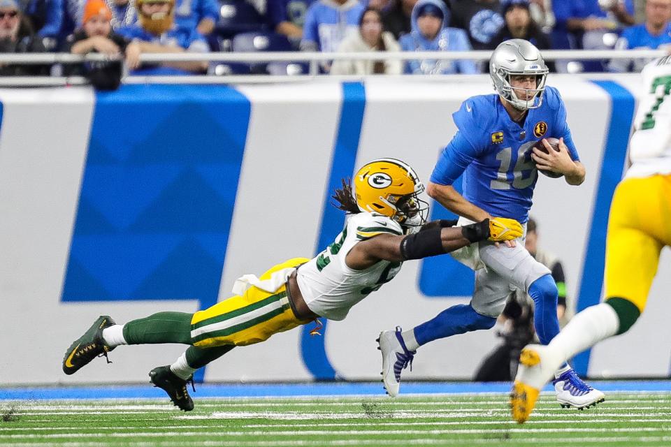 Green Bay Packers linebacker Rashan Gary tackles Detroit Lions quarterback Jared Goff during the first half at Ford Field in Detroit on Thursday, Nov. 23, 2023.