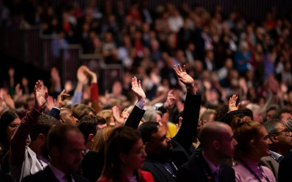 Labour Party members vote during the party's conference in Liverpool - Adam Vaughan/Shutterstock