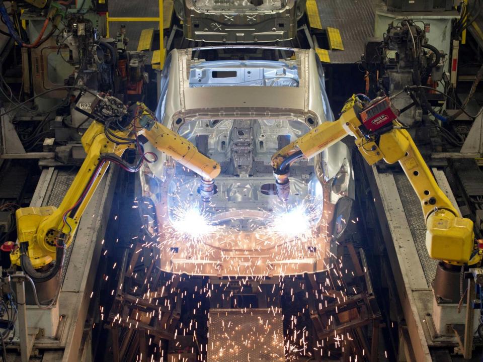 Robots weld vehicle panels at the body shop at Nissan's Sunderland plant: AFP/Getty