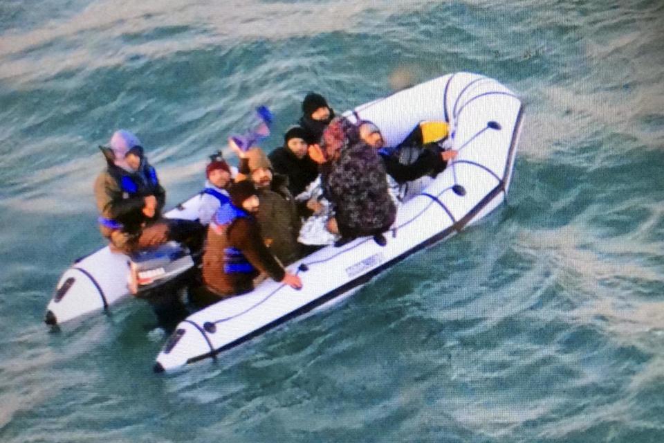 Rescued: This image provided by the Marine Nationale (French Navy) shows migrants aboard a rubber boat after being intercepted by French authorities, off the port of Calais, northern France (Marine Nationale via AP)