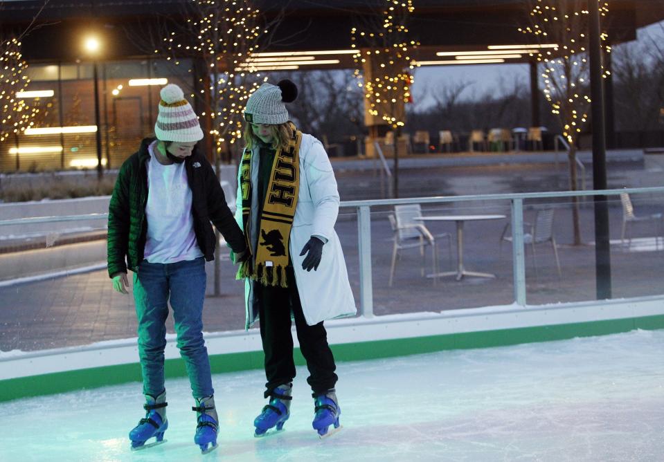 Karrer Middle School sixth-graders Ella Gore, 11, and Elizabeth Black, 11, skate Jan. 7.