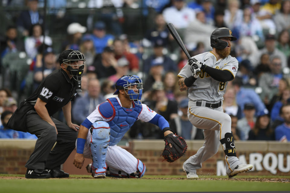 Pittsburgh Pirates' Ben Gamel, right, watches his RBI-single during the second inning of a baseball game against the Chicago Cubs, Sunday, April 24, 2022, in Chicago. (AP Photo/Paul Beaty)