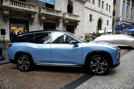 Chinese electric vehicle start-up Nio Inc. vehicles are on display in front of the New York Stock Exchange (NYSE) to celebrate the company’s initial public offering (IPO) in New York, U.S., September 12, 2018. REUTERS/Brendan McDermid