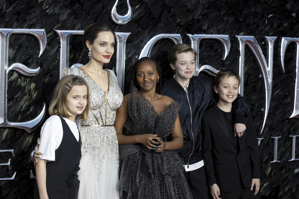 Actress Angelina Jolie, second Left, and her children Vivienne Jolie-Pitt, from left, Zahara Jolie-Pitt, Shiloh Jolie-Pitt and Knox Leon Jolie-Pitt pose for photographers on arrival at the Premiere of the film 'Maleficent Mistress of Evil' in central London on Wednesday, Oct. 9, 2019. (Photo by Grant Pollard/Invision/AP)