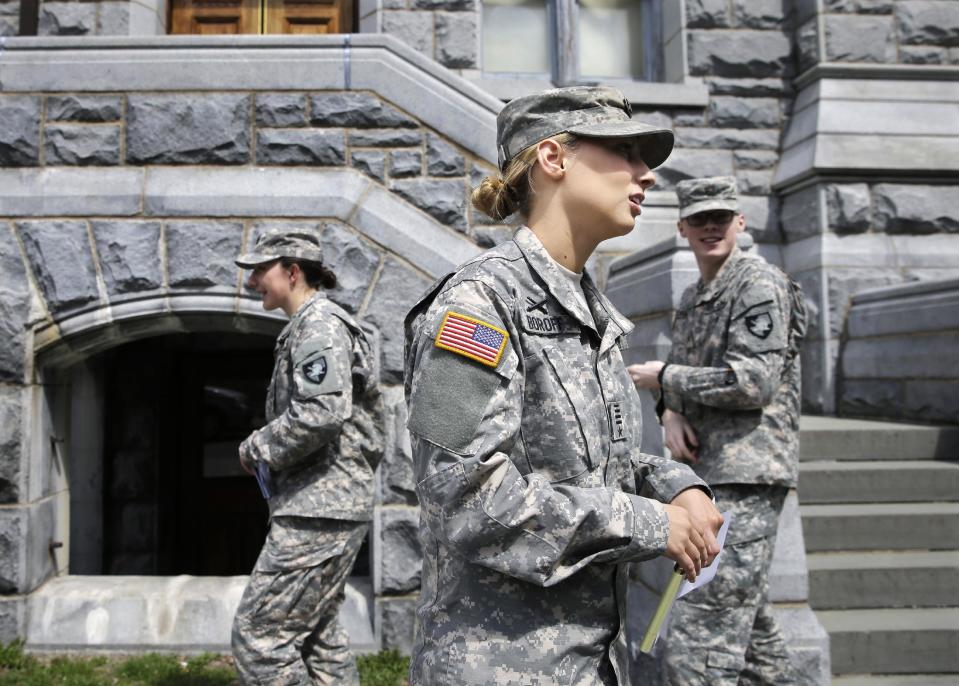 In this April 9, 2014 photo, West Point cadet Austen Boroff, center, of Chatham, N.J., gathers with others as she waits to march to lunch at the United States Military Academy in West Point, N.Y. With the Pentagon lifting restrictions for women in combat jobs, Lt. Gen. Robert Caslen Jr. has set a goal of boosting the number of women above 20 percent for the new class reporting this summer. (AP Photo/Mel Evans)
