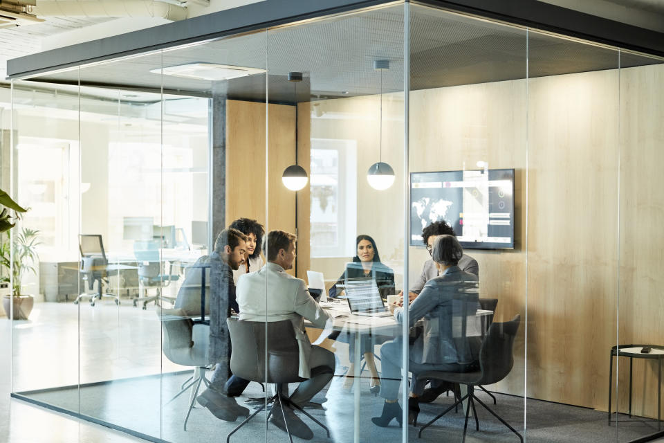 A group of employees in a meeting