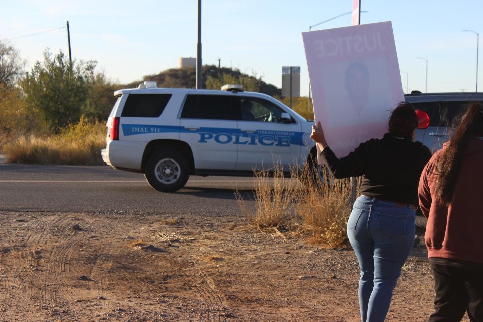 The family of Raymond Mattia and attendees gather outside of the Tohono O'odham Nation Police Department in Sells, Arizona, for a peaceful protest calling for more accountability from the department on Friday, December 15, 2023.