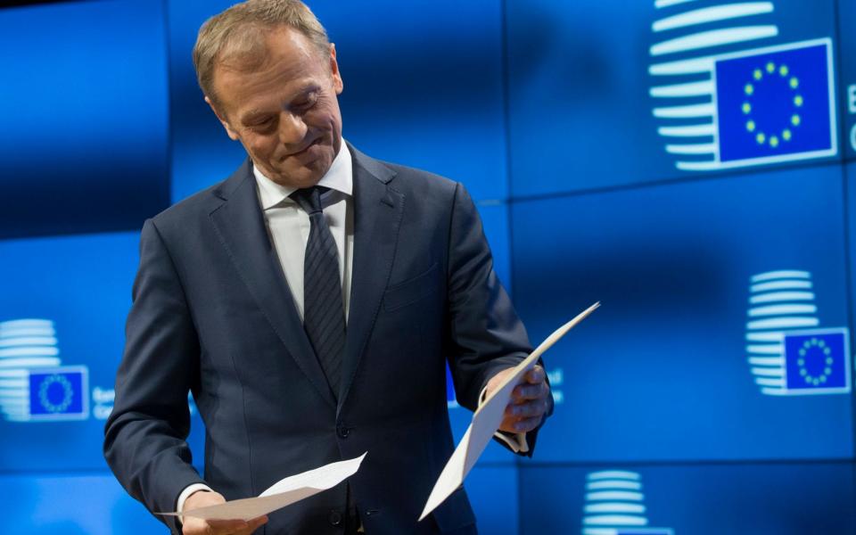 European Council president Donald Tusk holds the letter giving Britain's official notice under Article 50 - Credit: EPA