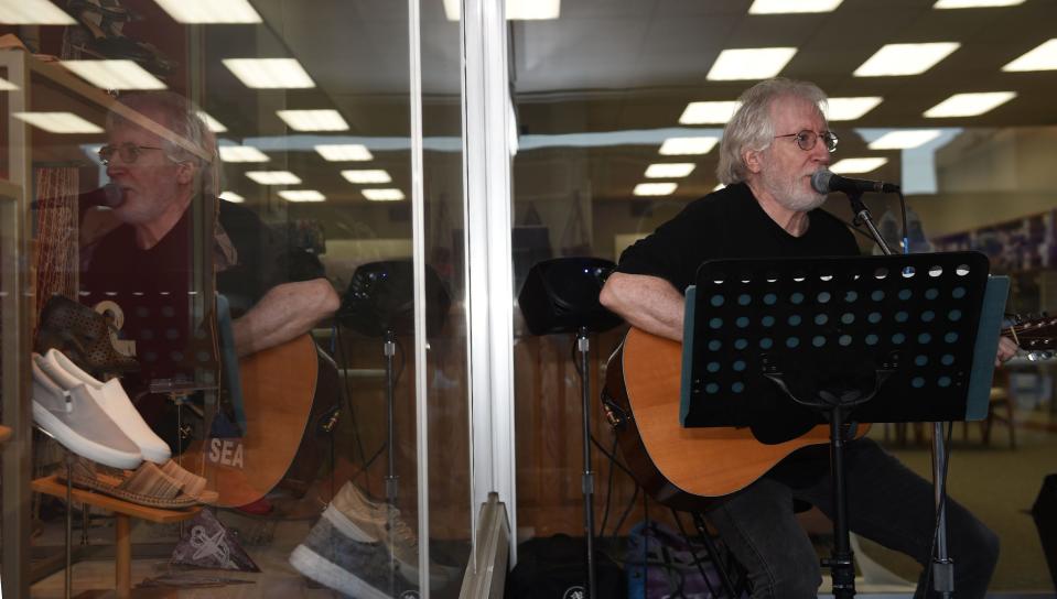Larry "Red" Stoltenberg performs at Emerhoff's Footwear during the Downtown Ames Music Walk in 2021. He returns to Emerhoff's Thursday evening for the Music Walk.