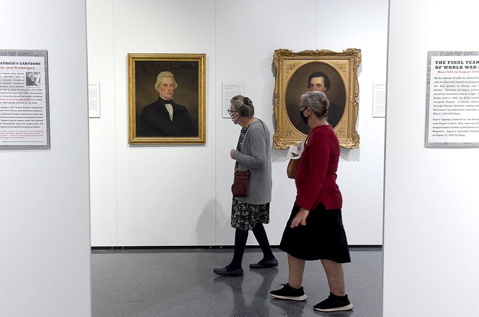 Judy Marsden, left, and Merna Appleton, both of Columbia, browse art Tuesday in the State Historical Society of Missouri Center for Missouri Studies Art Gallery.