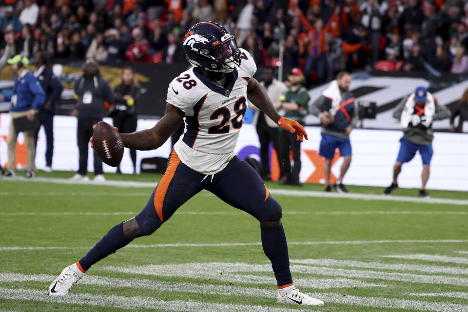 Denver Broncos running back Latavius Murray (28) celebrates a touchdown during the NFL football game between Denver Broncos and Jacksonville Jaguars at Wembley Stadium in London, Sunday, Oct. 30, 2022. (AP Photo/Ian Walton)