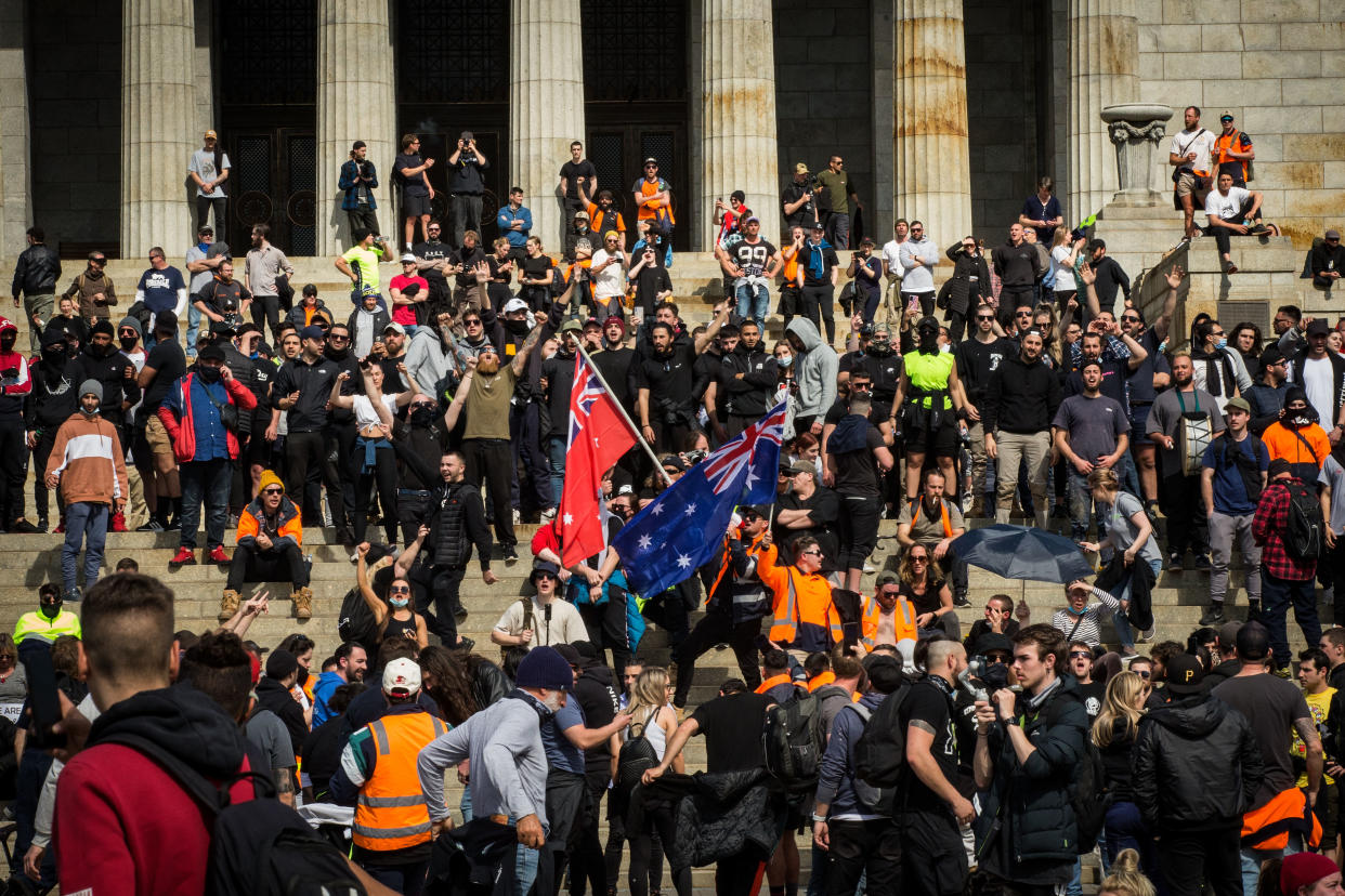 MELBOURNE, AUSTRALIA - SEPTEMBER 22: Protesters gather at the Shrine of Remembrance on September 22, 2021 in Melbourne, Australia. Protests started on Monday over new COVID-19 vaccine requirements for construction workers but  turned into larger and at times violent demonstrations against lockdown restrictions in general. Melbourne is currently subject to COVID-19 lockdown restrictions, with people only permitted to leave home for essential reasons. (Photo by Darrian Traynor/Getty Images)