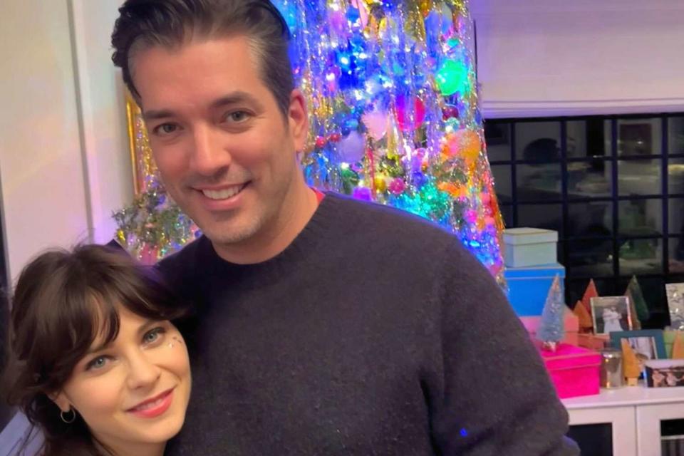 <p>Jonathan Scott/instagram</p> Jonathan Scott and Zooey Deschanel pose in front of a Christmas tree