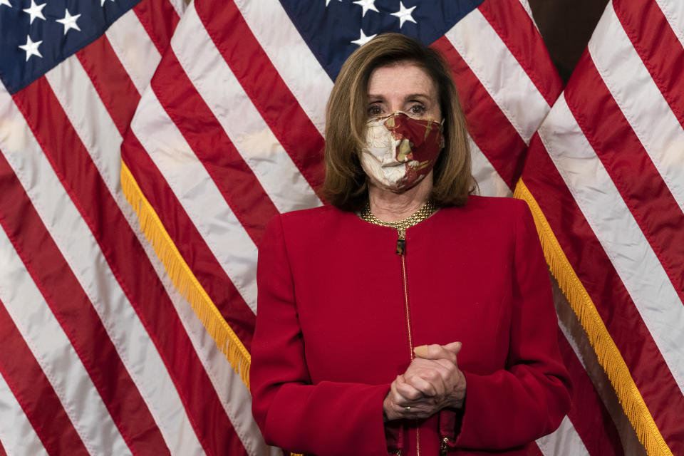 House Speaker Nancy Pelosi, of Calif., attends a ceremonial swearing-in of Rep. Kwanza Hall, D-Ga., on Capitol Hill, Thursday, Dec. 3, 2020, in Washington. (AP Photo/Jacquelyn Martin)