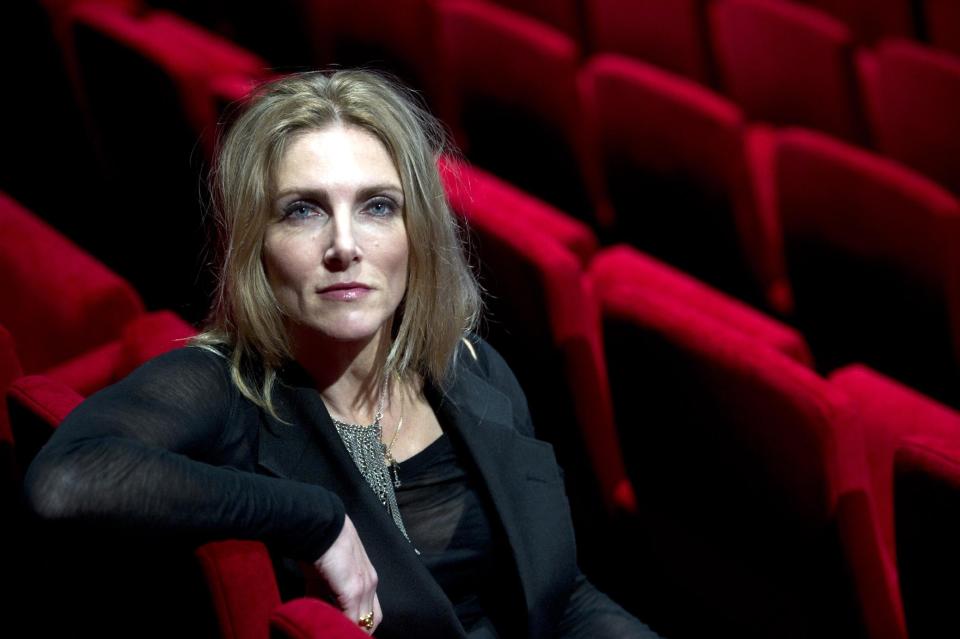 In this photo taken Friday, May 2, 2014 Dutch script writer Jessica Durlacher poses during an interview with the Associated Press at Theater Amsterdam. Seeking to engage a new generation with the tragic story of Anne Frank, a major new play based on the Jewish teenager's diary opens Thursday, May 8, 2014 in Amsterdam. It's the first time a theatrical production has been forged directly from Frank's actual writings since the award-winning 1950s play that escalated her story, then little-known, to the world's attention. It's being staged in a purpose-built 1,100 seat theater that includes a replica of the secret apartment where Frank and her family hid from the Nazis in World War II. (AP Photo/Evert Elzinga)