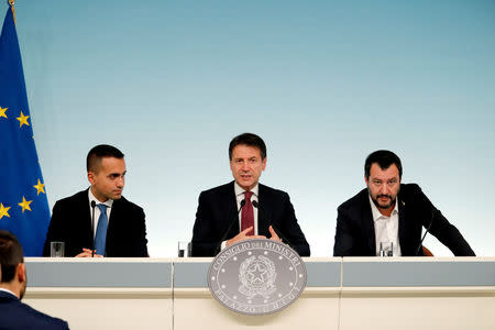 Italy's Minister of Labor and Industry Luigi Di Maio, Prime Minister Giuseppe Conte and Interior Minister Matteo Salvini attend a news conference after a cabinet meeting at Chigi Palace in Rome, Italy, October 20 2018. REUTERS/Remo Casilli