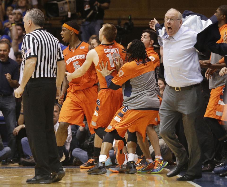 Syracuse coach Jim Boeheim, right, and players react to an official's call late in the second half of an NCAA college basketball game against Duke in Durham, N.C., Saturday, Feb. 22, 2014. Duke won 66-60. (AP Photo/Gerry Broome)
