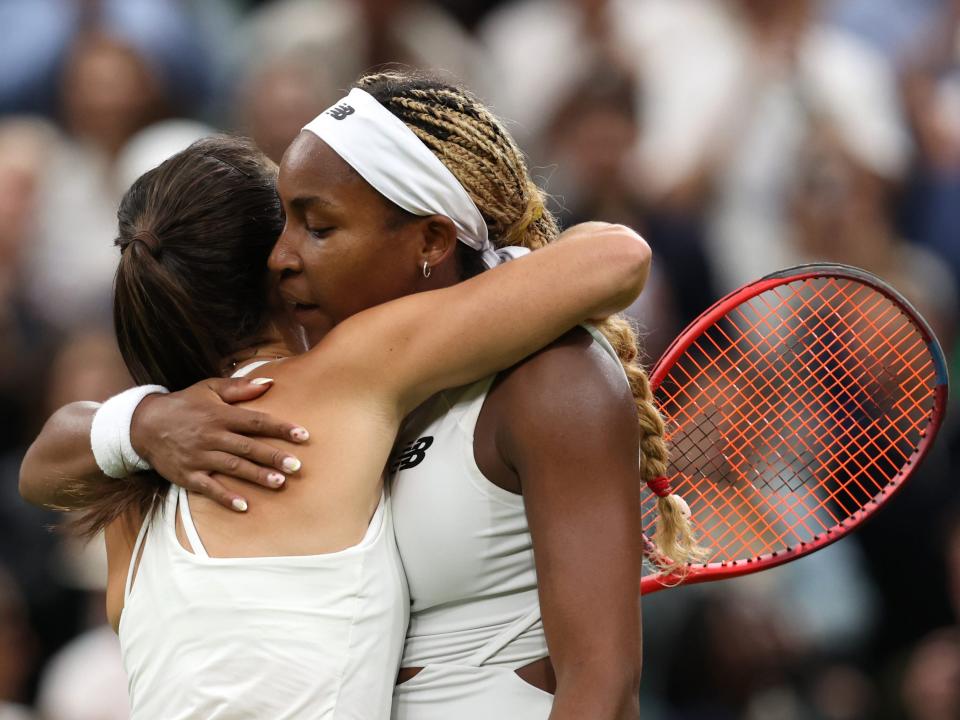 Emma Navarro and Coco Gauff embrace after Navarro won in the fourth round of Wimbledon 2024.