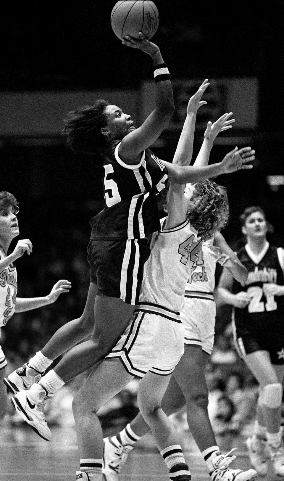 Donna Harris, Father Ryan High (1986-89): Here, Harris, now a member of Vanderbilt University, gets a shot off despite the tight coverage by Tennessee Tech’s Cecilia Ramsey (44) at Memorial Gym on Dec. 4, 1989.