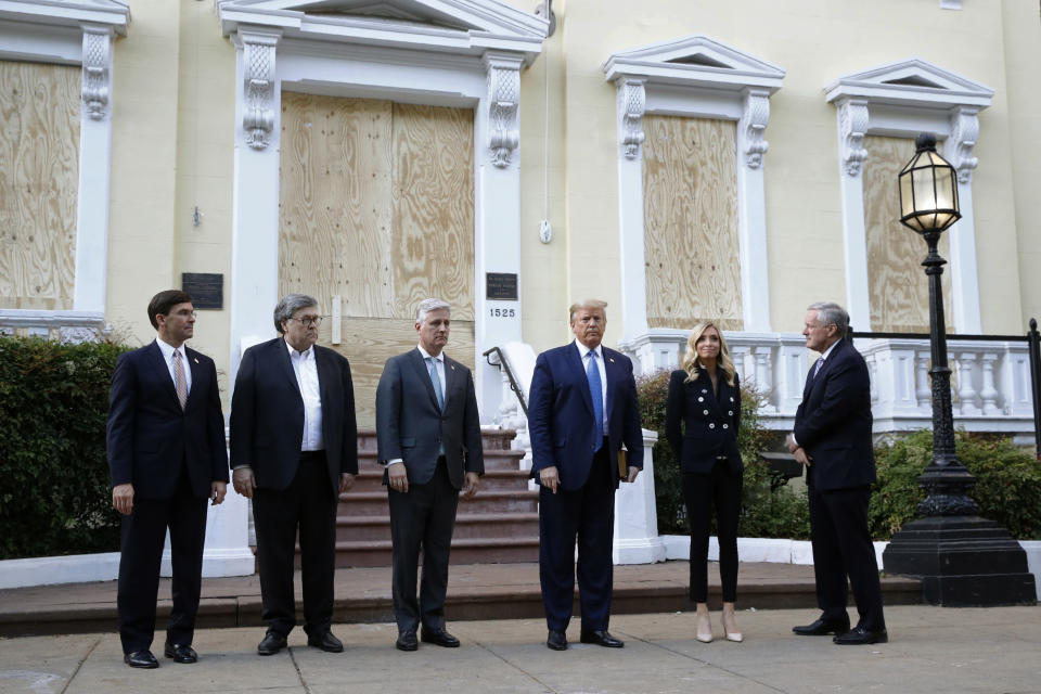 President Donald Trump stands outside St. John's Church across Lafayette Park from the White House Monday, June 1, 2020, in Washington. Part of the church was set on fire during protests on Sunday night. Standing with Trump are Defense Secretary Mark Esper, from left, Attorney General William Barr, White House national security adviser Robert O'Brien, White House press secretary Kayleigh McEnany and White House chief of staff Mark Meadows. (AP Photo/Patrick Semansky)