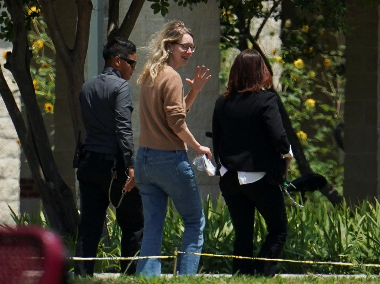 Theranos founder Elizabeth Holmes arrives to begin serving her prison sentence for defrauding investors in the failed blood-testing startup, at the Federal Prison Camp in Bryan, Texas, U.S. May 30, 2023.