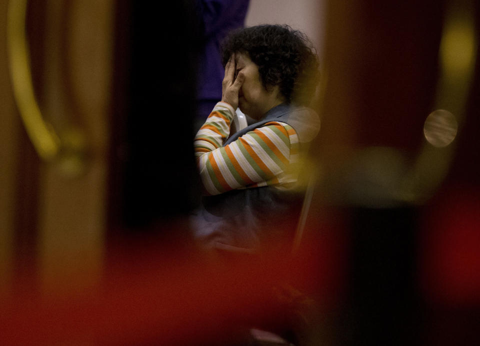 A relative of Chinese passengers aboard the missing Malaysia Airlines Flight MH370 waits for a news briefing by the Airlines' officials at a hotel ballroom in Beijing, China, Tuesday, March 18, 2014. Families of the passengers aboard the missing plane decided to organize a hunger strike to express their anger and disappointment at the handling of the situation by authorities. They decided on the action after a daily morning meeting with two officials from Malaysia Airlines. The plane has been missing since March 8, and contradictory information plus the fact there has been no sign of the plane has left family members frustrated. (AP Photo/Andy Wong)