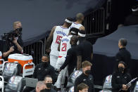 Los Angeles Clippers forward Nicolas Batum, top, walks through a tunnel in front of center DeMarcus Cousins (15) and guard Patrick Beverley (21) after the Phoenix Suns defeated the Clippers in Game 2 of the NBA basketball Western Conference Finals, Tuesday, June 22, 2021, in Phoenix. (AP Photo/Matt York)