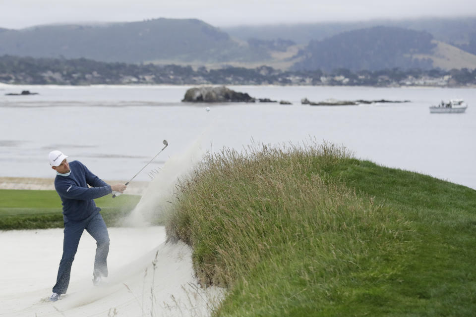 Justin Rose, of England, hits out of the bunker on the 18th hole during the third round of the U.S. Open golf tournament Saturday, June 15, 2019, in Pebble Beach, Calif. (AP Photo/Marcio Jose Sanchez)