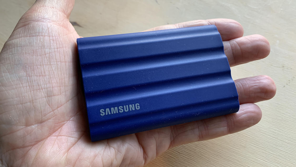  Samsung T7 Shield held in a hand. 