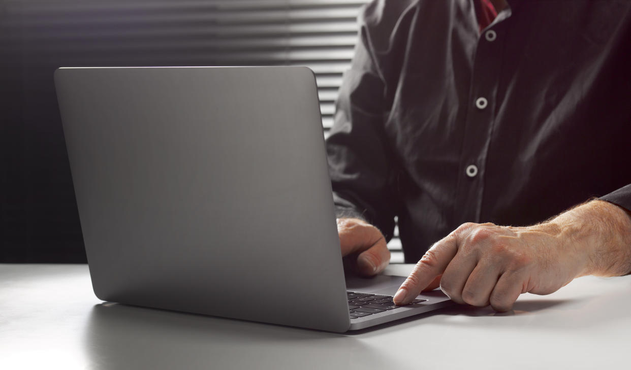 A man at his laptop. (PHOTO: Getty Images)