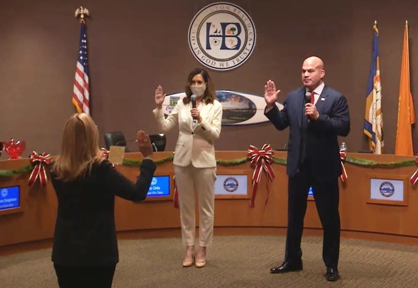 Huntington Beach City Clerk Robin Estanislau swore in new mayor Kim Carr and mayor pro tem Tito Ortiz