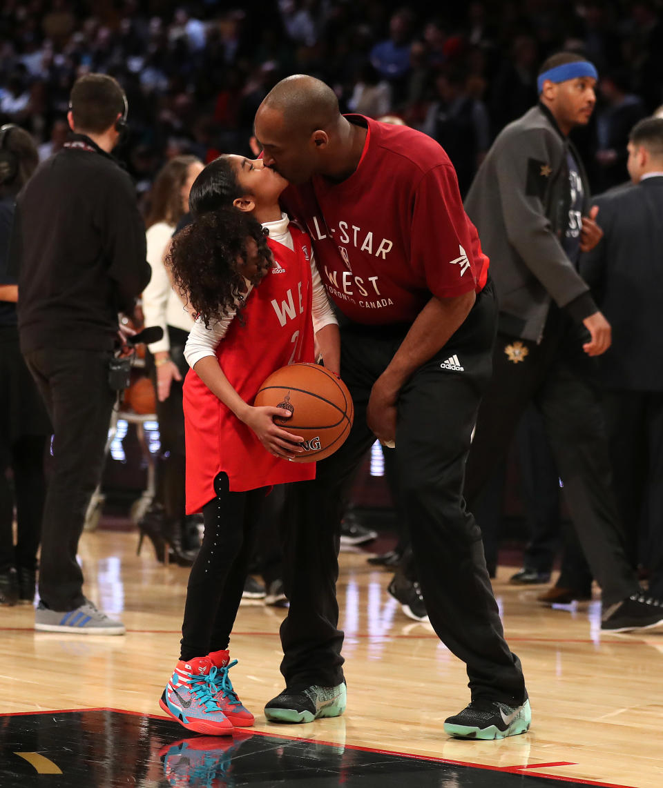 Kobe Bryant gets a kiss from his daughter Gianna Bryant during the 65th NBA All-Star Game at the Air Canada Centre in Toronto. February 14, 2016. (Steve Russell/Toronto Star via Getty Images)